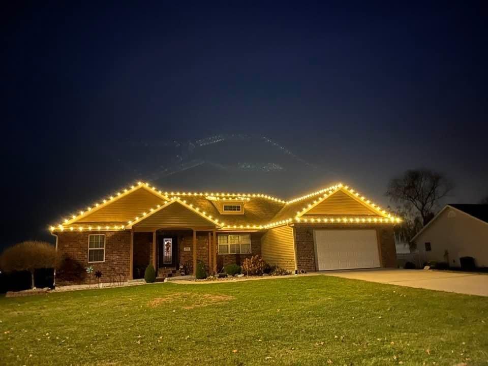 Close view of evenly spaced warm white C9 bulbs along a roof edge