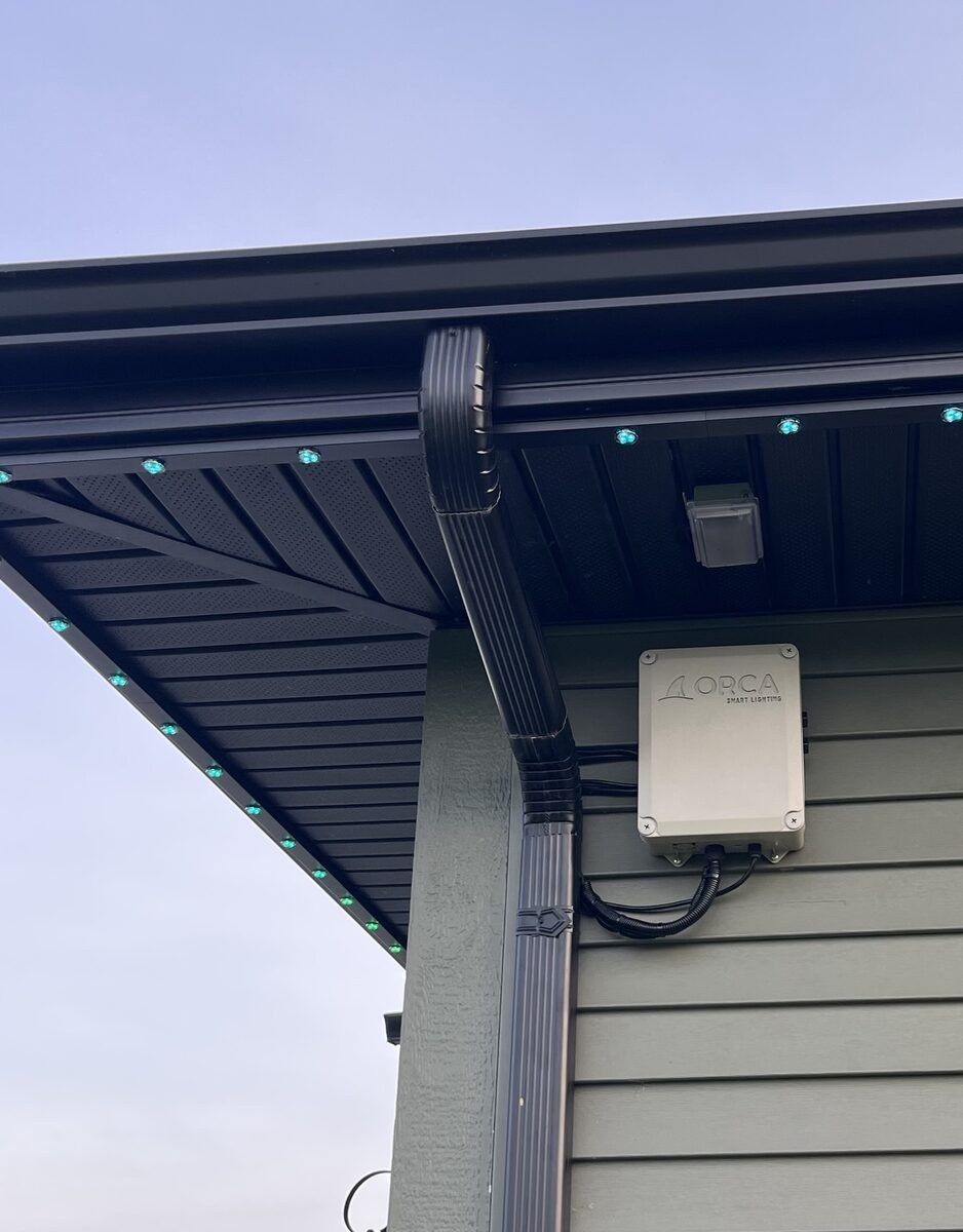 Permanent lighting track and weatherproof controller installed under a soffit, built to last through Illinois winters