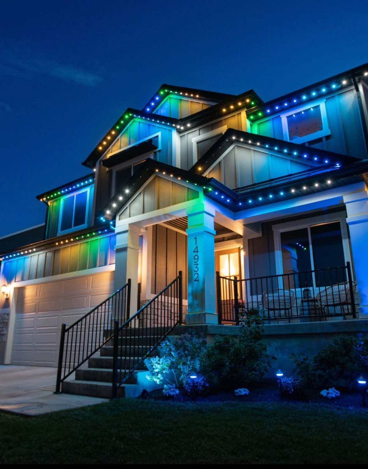 Craftsman home with permanent roofline lighting on every gable, an example of a full permanent install