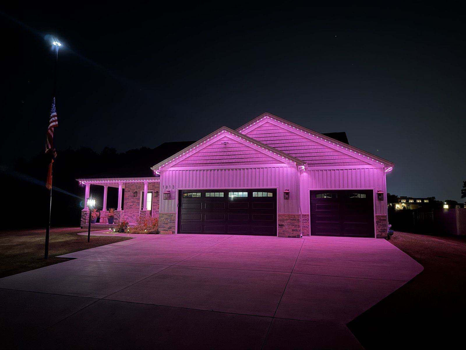 Permanent lighting on the roofline of a home like those we install in Normal, Illinois