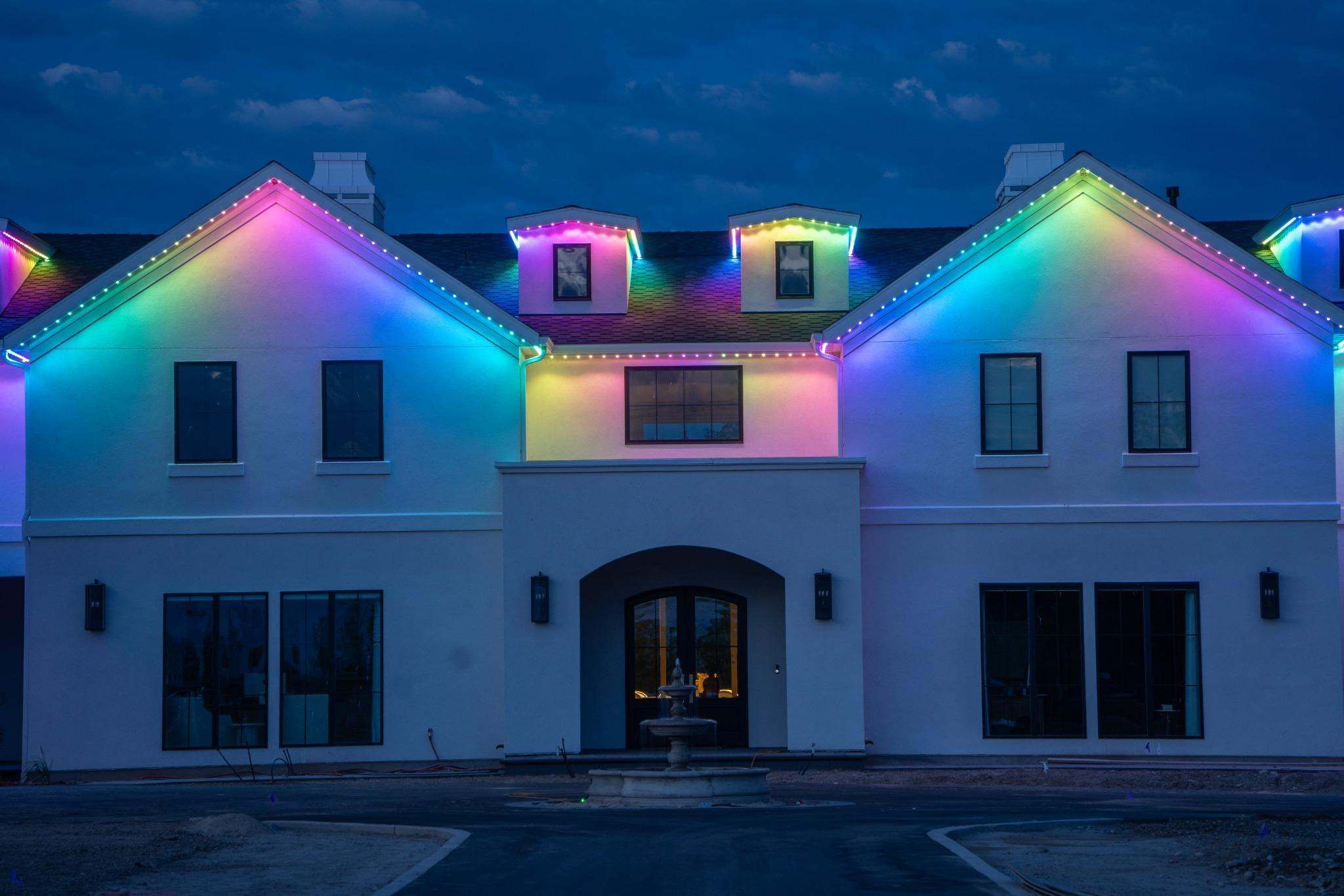 Permanent lighting on the roofline of a home like those we install in Oakland, Illinois