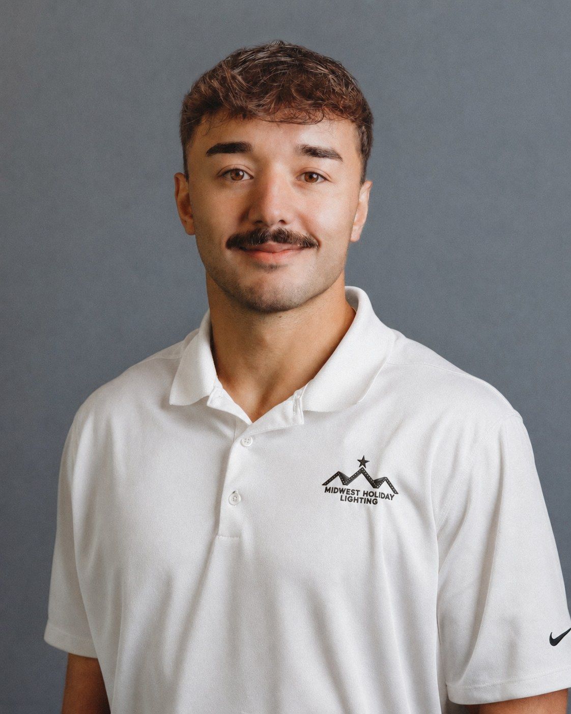 Tom Johnson, founder of Midwest Holiday Lighting, in a company polo